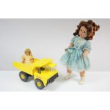 A Tonka toy tipper truck; & two celluloid dolls.