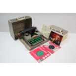 A Lilliput child's typewriter with fibre-covered case; & thirty-two various 45 r.p.m. records.