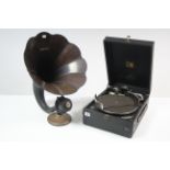 An HMV portable gramophone in black fibre-covered case, & a gramophone horn, 15¼" diam.