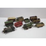 Two tinplate clockwork-operated “O” gauge scale model locomotives; eight ditto items of rolling