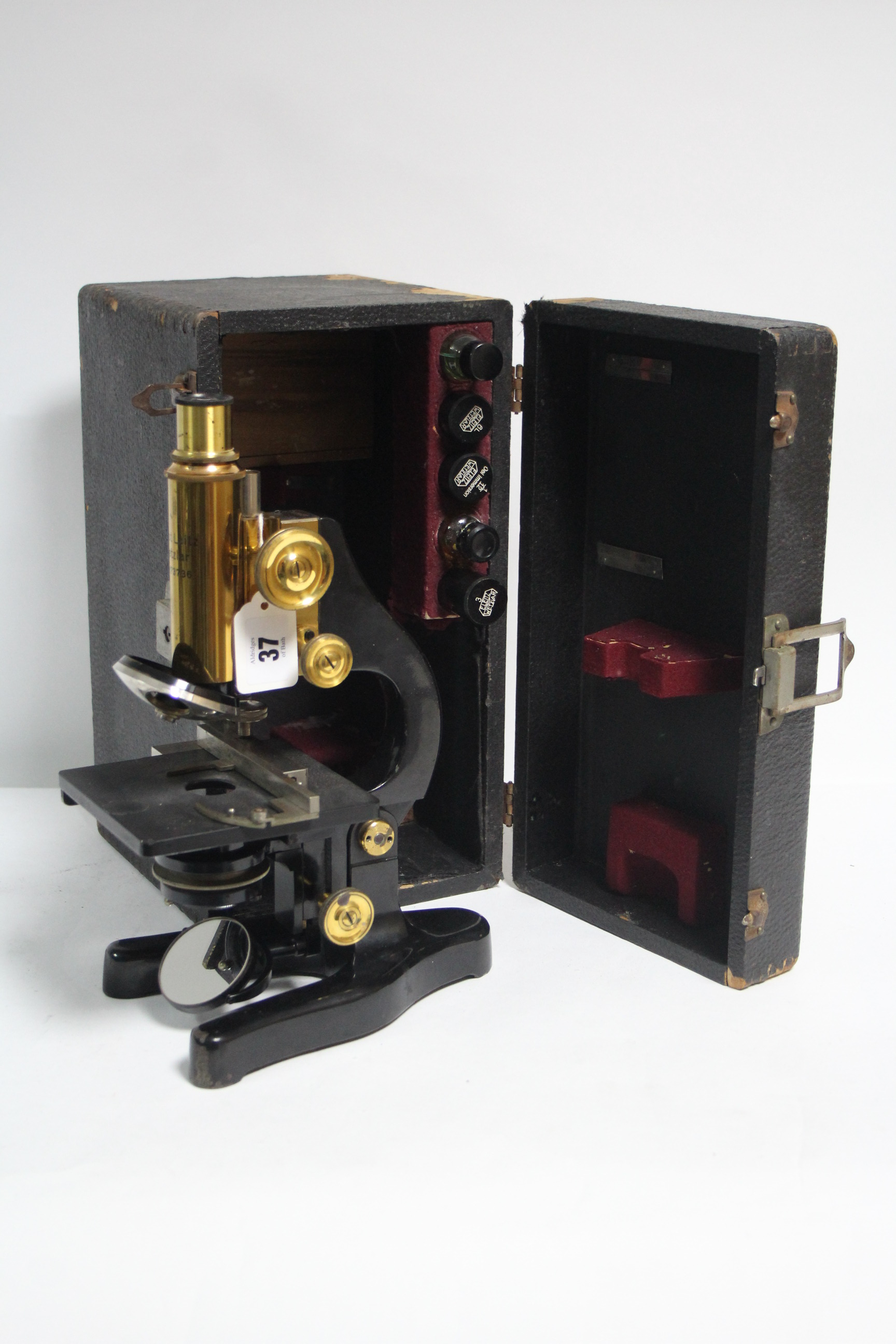 AN ERNST LEITZ WETZLAR BALCK LACQUERED MONOCULAR MICROSCOPE WITH BRASS FITTINGS (No. 27373 6),