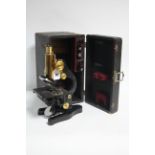 AN ERNST LEITZ WETZLAR BALCK LACQUERED MONOCULAR MICROSCOPE WITH BRASS FITTINGS (No. 27373 6),