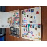 Various British & foreign stamps contained in two albums; & ten various commemorative Crowns.