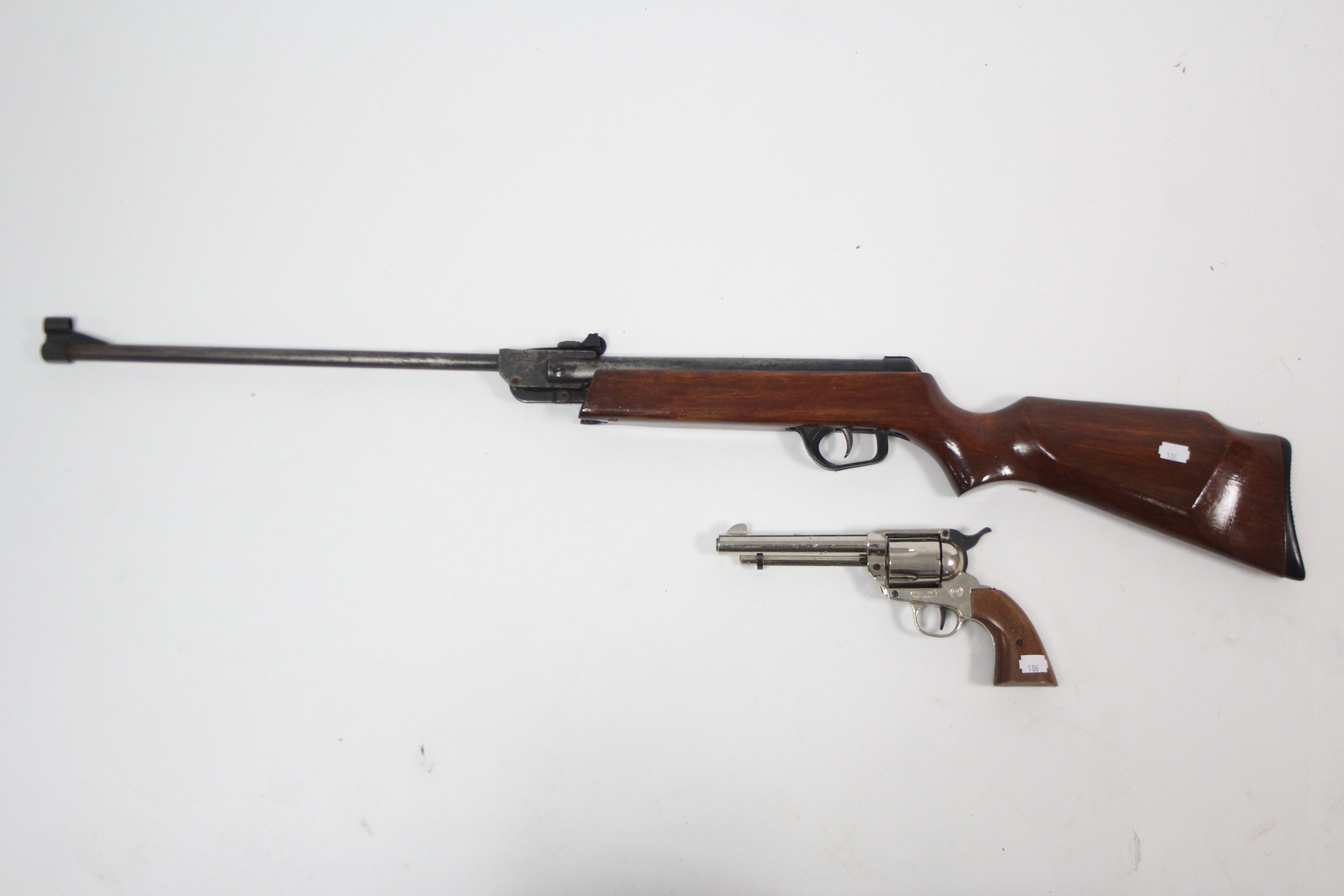 A Spanish .22 calibre air rifle; & a replica revolver.