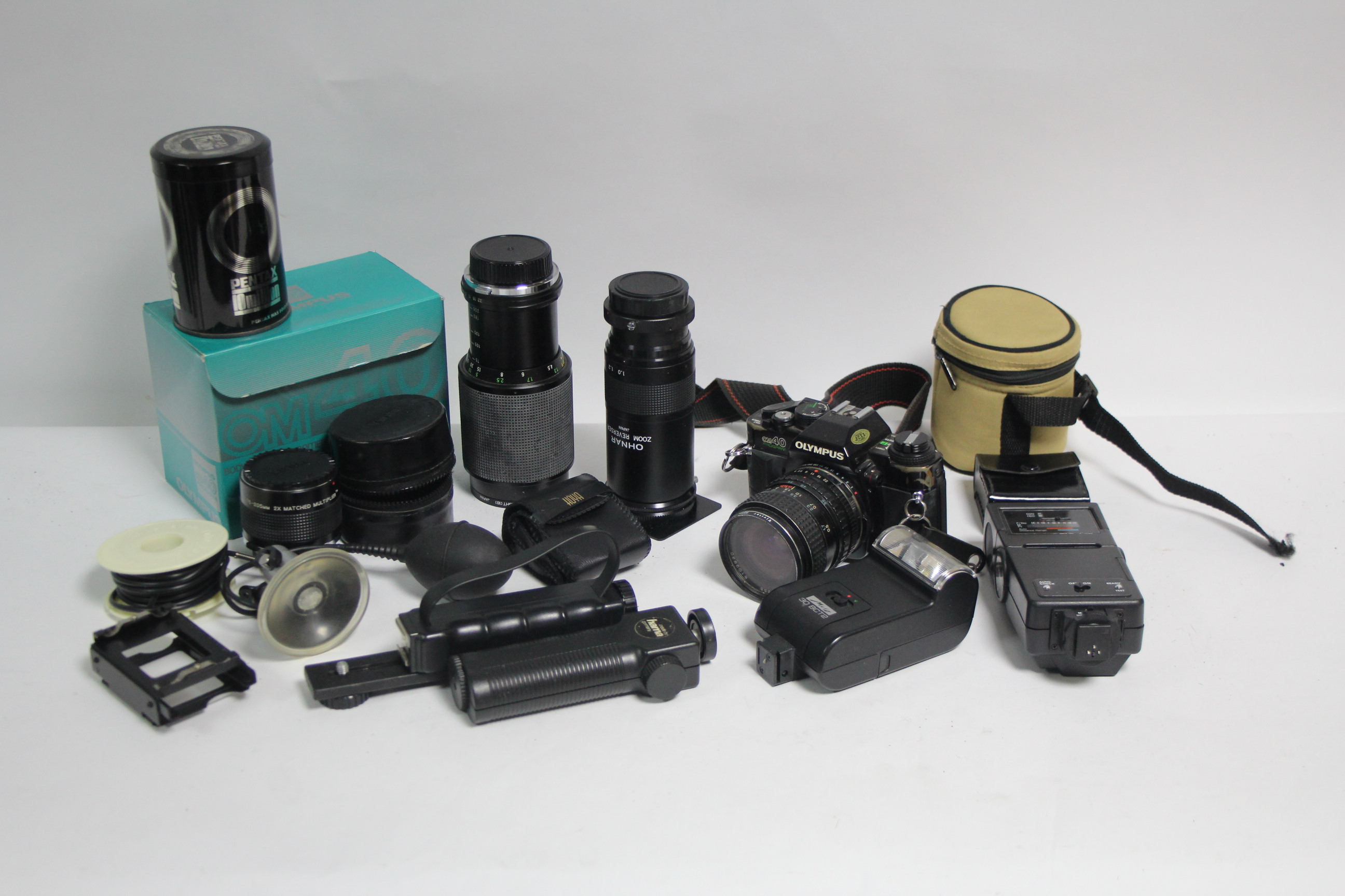 An Olympus “OM40” camera; & various camera accessories.