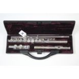 A Buffet of Paris chrome flute, 26" long, with case; & a small fifteen string harp, 14½" wide.