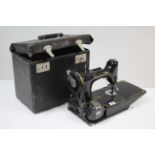 A Singer electric sewing machine (lacking lead), with case.