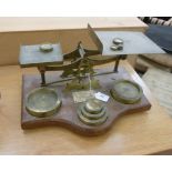 Early 20thC commercial, lacquered brass postal scales with tablet weights,