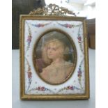 An early 20thC Continental portrait miniature, a head and shoulders study of a girl,