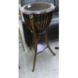 An Edwardian style string inlaid mahogany, basket design jardiniere stand with a brass liner,