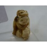 A late 19th/20thC Japanese carved ivory netsuke,