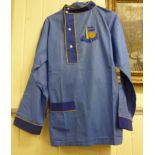 A pair of piped yellow trimmed, two tone blue cotton collarless pyjamas,