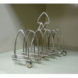 A late 19th/early 20thC silver plated expandable, six double arched toastrack,