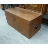 An early 20thC boarded teak chest, having straight sides,