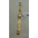 A lady's International Watch Co 9ct gold round cased, textured bracelet wristwatch,