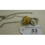 A lady's Buler textured yellow metal plated steel cased necklace watch,