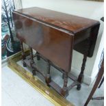 An early 20thC mahogany gateleg occasional table, the top having rounded corners,
