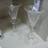 Two similar 19thC ale glasses, each with a bell shaped bowl, on a slightly bulbous,