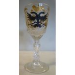 An early 20thC cut crystal wine glass,