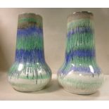 A pair of Shelley china vases of bulbous form with long, tapered necks, decorated in tones of green,