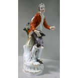 A 20thC Meissen porcelain figure, a man wearing a frockcoat and breeches,