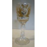 An early 20thC cut crystal wine glass,