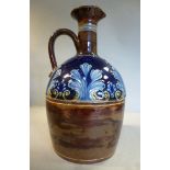 A late 19thC Doulton Lambeth blue and brown glazed stoneware whisky decanter with a narrow neck,