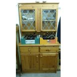 A modern honey coloured pine cottage dresser,