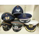 Six replicas of mainly military German peaked caps: to include a Kriegsmarine example OS9