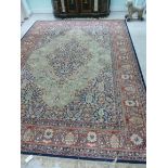 A Super Keshan carpet with a central medallion and foliage on a green ground 142'' x 108'' S