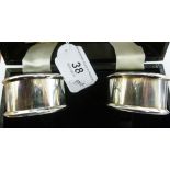 A pair of silver napkin rings,