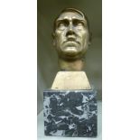 A cast brass bust of Adolph Hitler, on a black and white marble plinth 10.