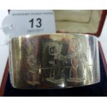 A silver napkin ring, depicting The Three Bears,