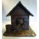 A Black Forest carved and stained limewood novelty cigar box,