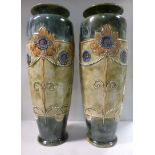 A pair of Royal Doulton stoneware vases of slender baluster form, decorated in tones of green,