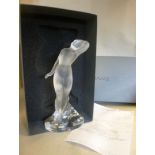 A modern Lalique part frosted glass standing nude with one arm raised,