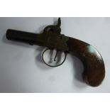 A mid 19thC percussion cap muff pistol with foliate engraved ornament and a plain walnut stock