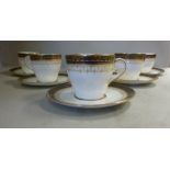 A set of six Royal Doulton china coffee cups and saucers,