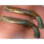 A pair of mid 19thC Thomas K Baker percussion action pistols,