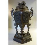 A 20thC Chinese cast and patinated bronze, twin handled censer of elongated, hexagonal form,