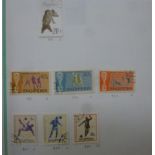 An uncollated album collection of postage stamps,