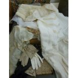 Early 20thC textiles: to include a 'cobweb' crocheted shawl; kid gloves;