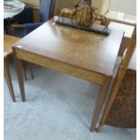 A Richard Williams walnut centre table with a burr walnut panelled top and frieze with a drawer,