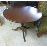 A George III mahogany pedestal table, the tip-top over a vase turned column,