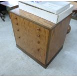 A Richard Williams exotic hardwood dressing chest with three long drawers and a filing drawer,