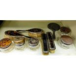 Ten similar silver and tortoiseshell moulded dressing table items: to include pair of hair and