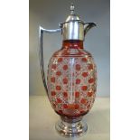 A Victorian style part Cranberry coloured, slice and hobnail cut wine jug of flattened,