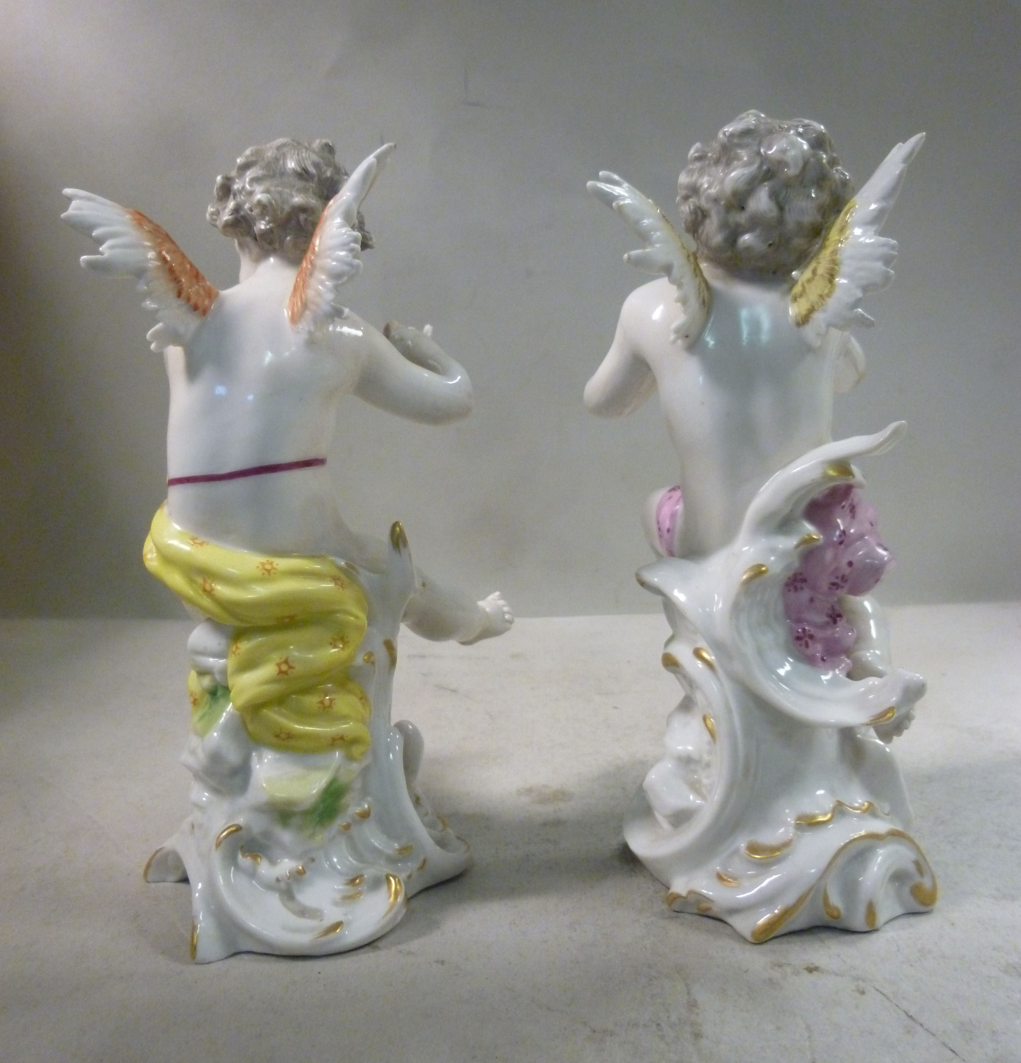 A pair of early 20thC Frankental porcelain seated cherubic figures, one playing panpipes, - Image 3 of 7