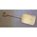 A 19thC rustically carved wooded grain shovel,