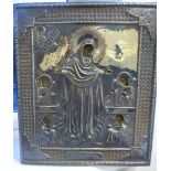 A Russian cast, embossed and chased silver icon, featuring inscribed banners,